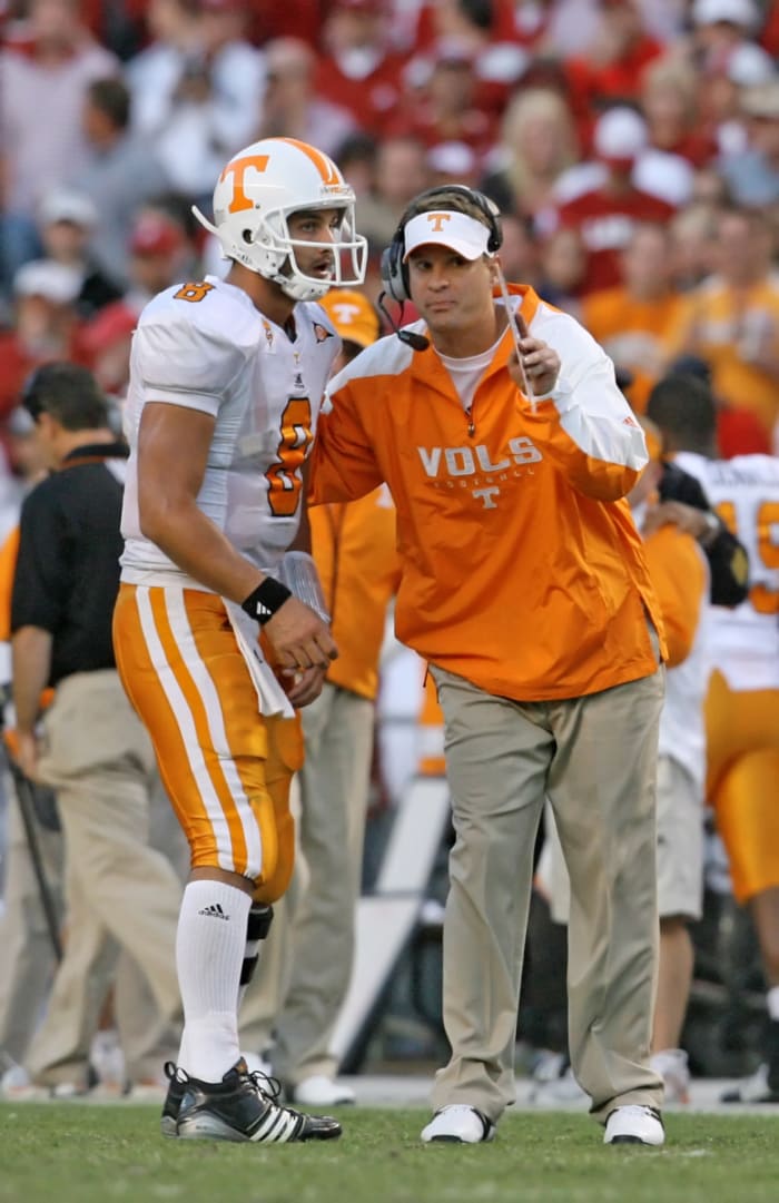 Lane Kiffin talks through a play with quarterback Jonathan Crompton during a 2009 game.